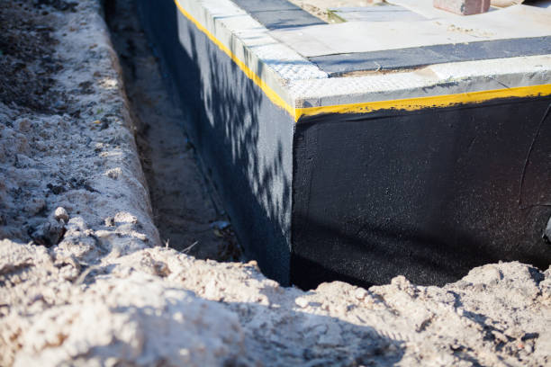 Professional Emergency Waterproofing technician working in Louisville, IL